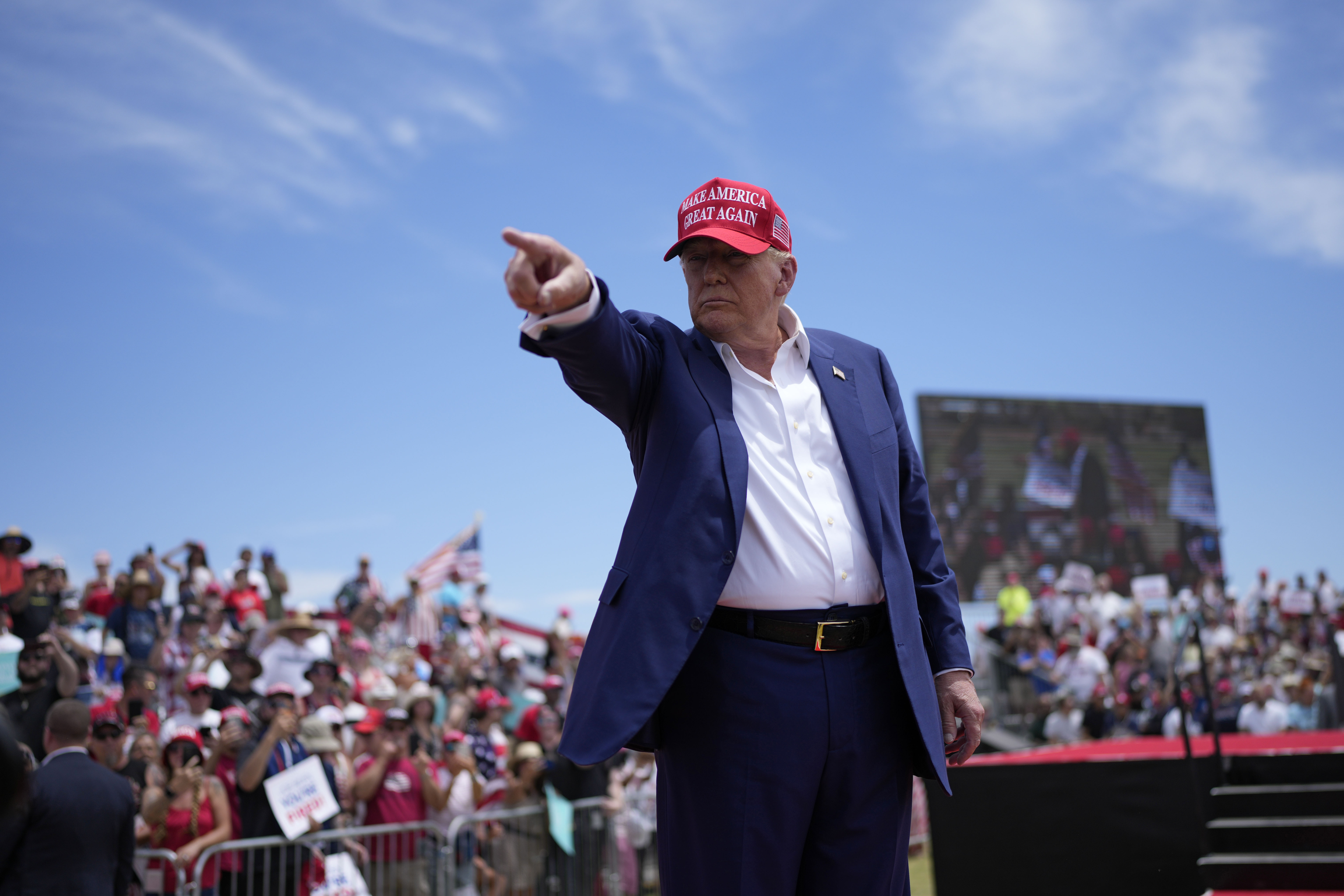 Former President Donald Trump motions to the crowd after speaking at a campaign rally. Former President Donald Trump motions to the crowd after speaking at a campaign rally.
