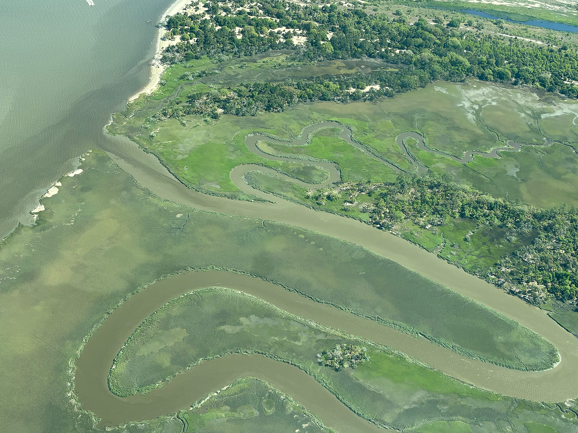 A river wends toward the ocean along Savannah’s vast tidal flats. A river wends toward the ocean along Savannah’s vast tidal flats.
