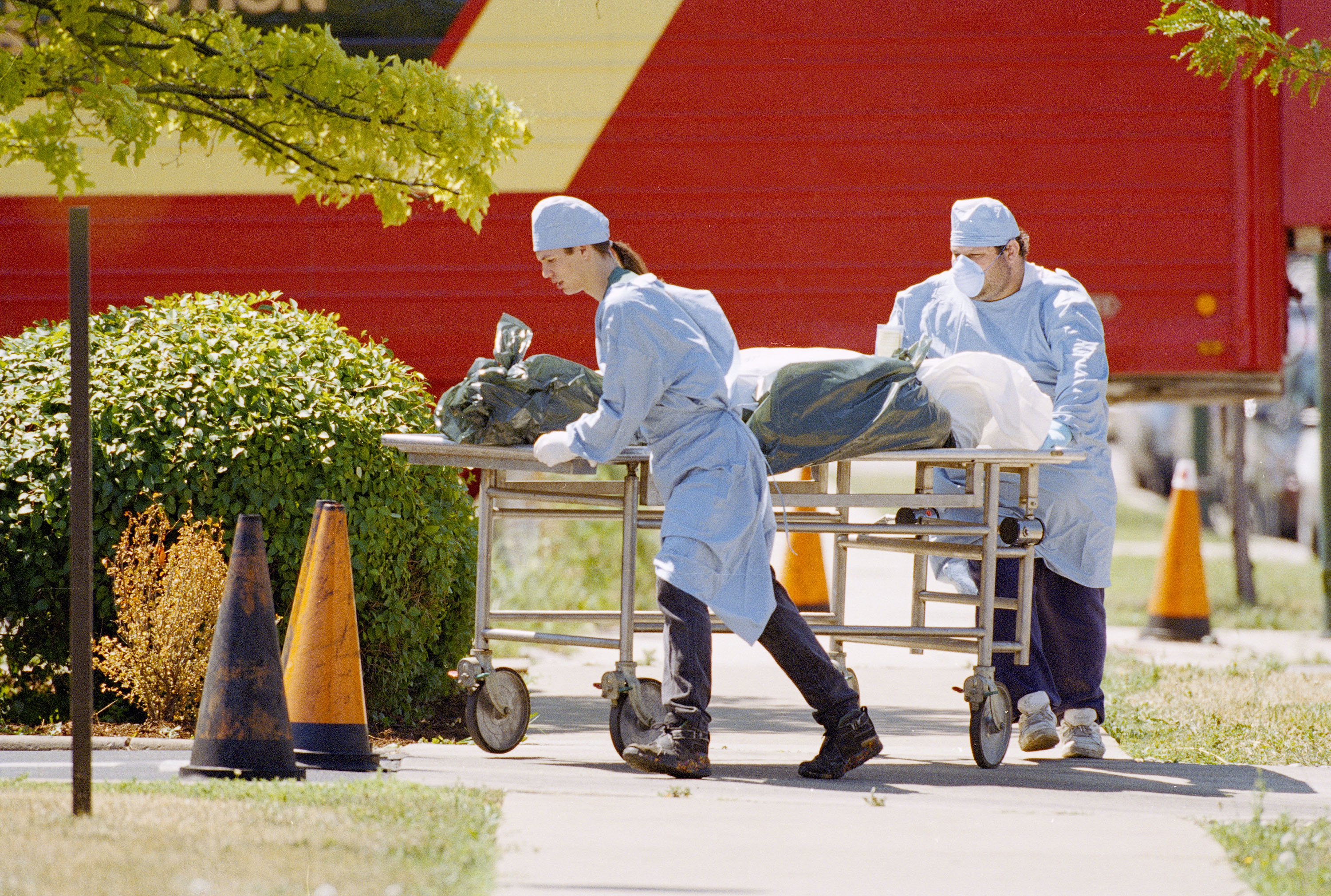 Workers at the Cook County morgue in Chicago wheel a body to refrigerator trucks on Tuesday, July 18, 1995. Several trucks were parked near the morgue to handle an overflow of bodies, most believed to be victims of the heat wave. Workers at the Cook County morgue in Chicago wheel a body to refrigerator trucks on Tuesday, July 18, 1995. Several trucks were parked near the morgue to handle an overflow of bodies, most believed to be victims of the heat wave.