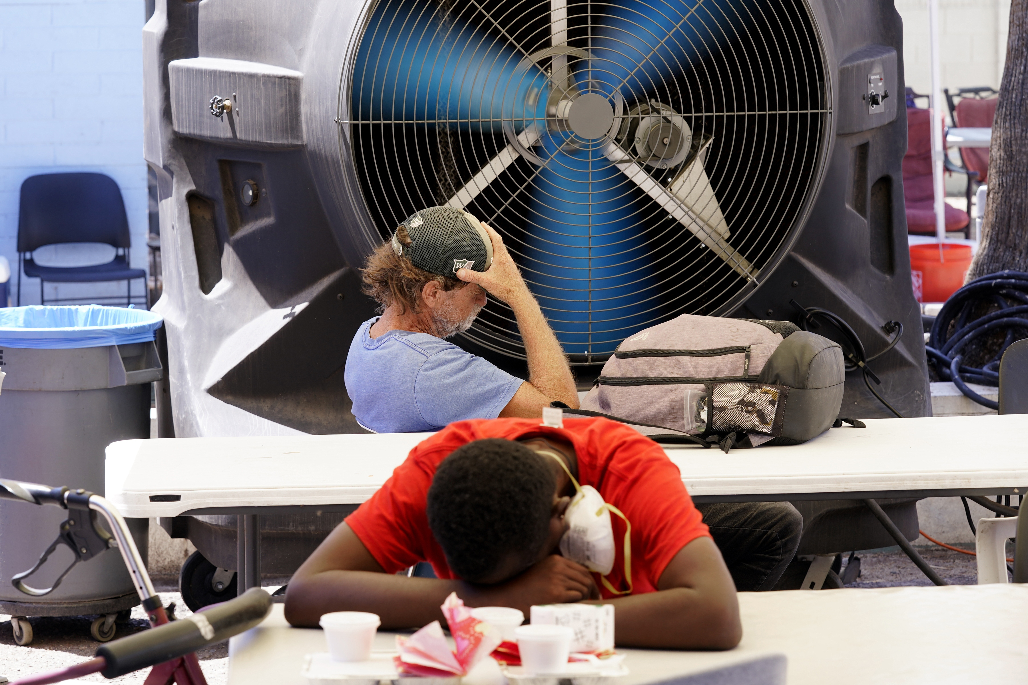 FILE - People try to keep cool at the Justa Center, a resource center catering to the older homeless population, as temperatures hit 110-degrees, July 19, 2022, in Phoenix. The Biden Administration Tuesday, July 26, unveiled a new website, heat.gov, that federal officials hope can help people and local governments beat the heat and keep it from getting deadly. FILE - People try to keep cool at the Justa Center, a resource center catering to the older homeless population, as temperatures hit 110-degrees, July 19, 2022, in Phoenix. The Biden Administration Tuesday, July 26, unveiled a new website, heat.gov, that federal officials hope can help people and local governments beat the heat and keep it from getting deadly.