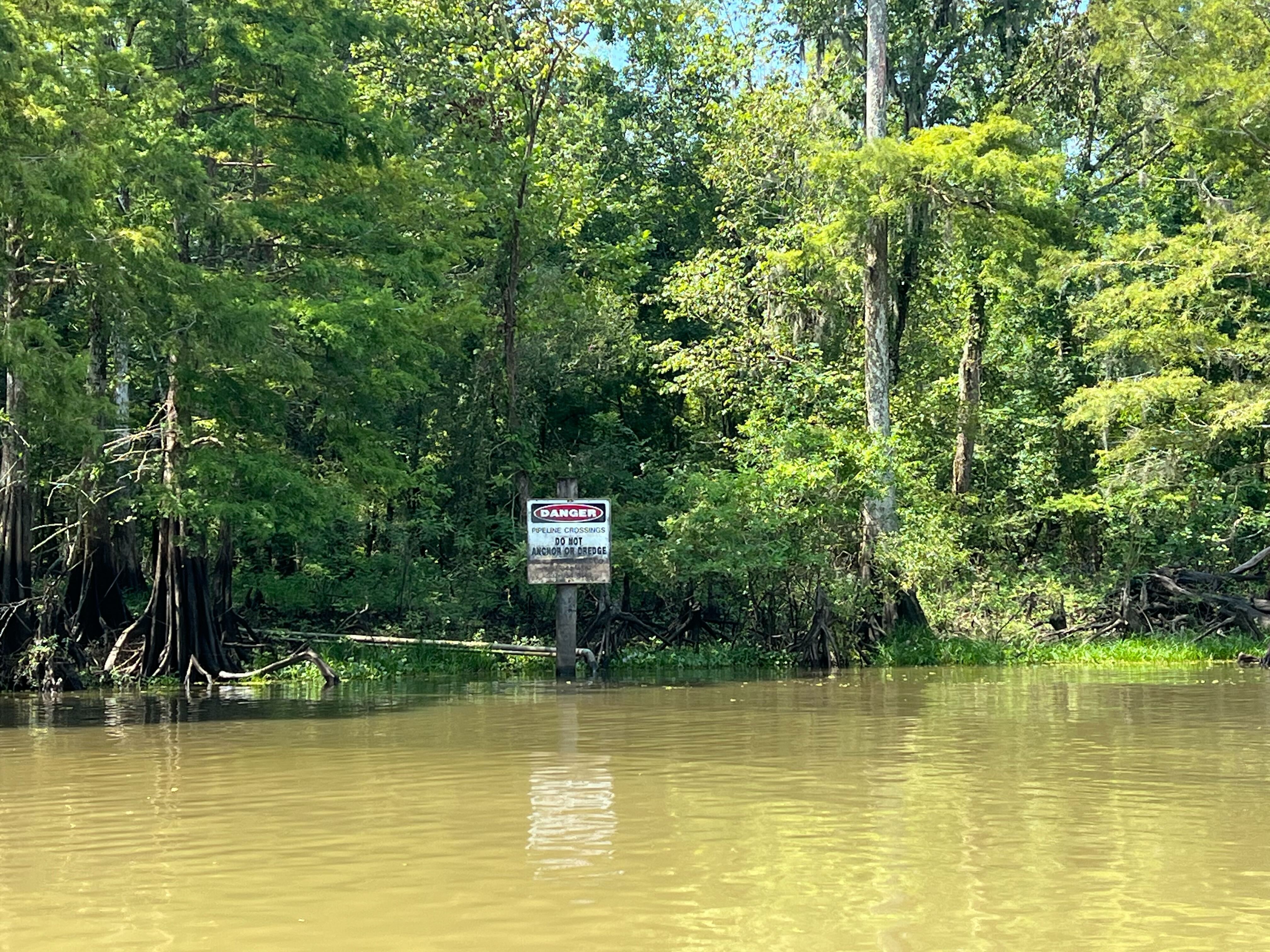 A sign in the Atchafalaya Basin near Bayou Sorrel warns of a pipeline crossing. A sign in the Atchafalaya Basin near Bayou Sorrel warns of a pipeline crossing.