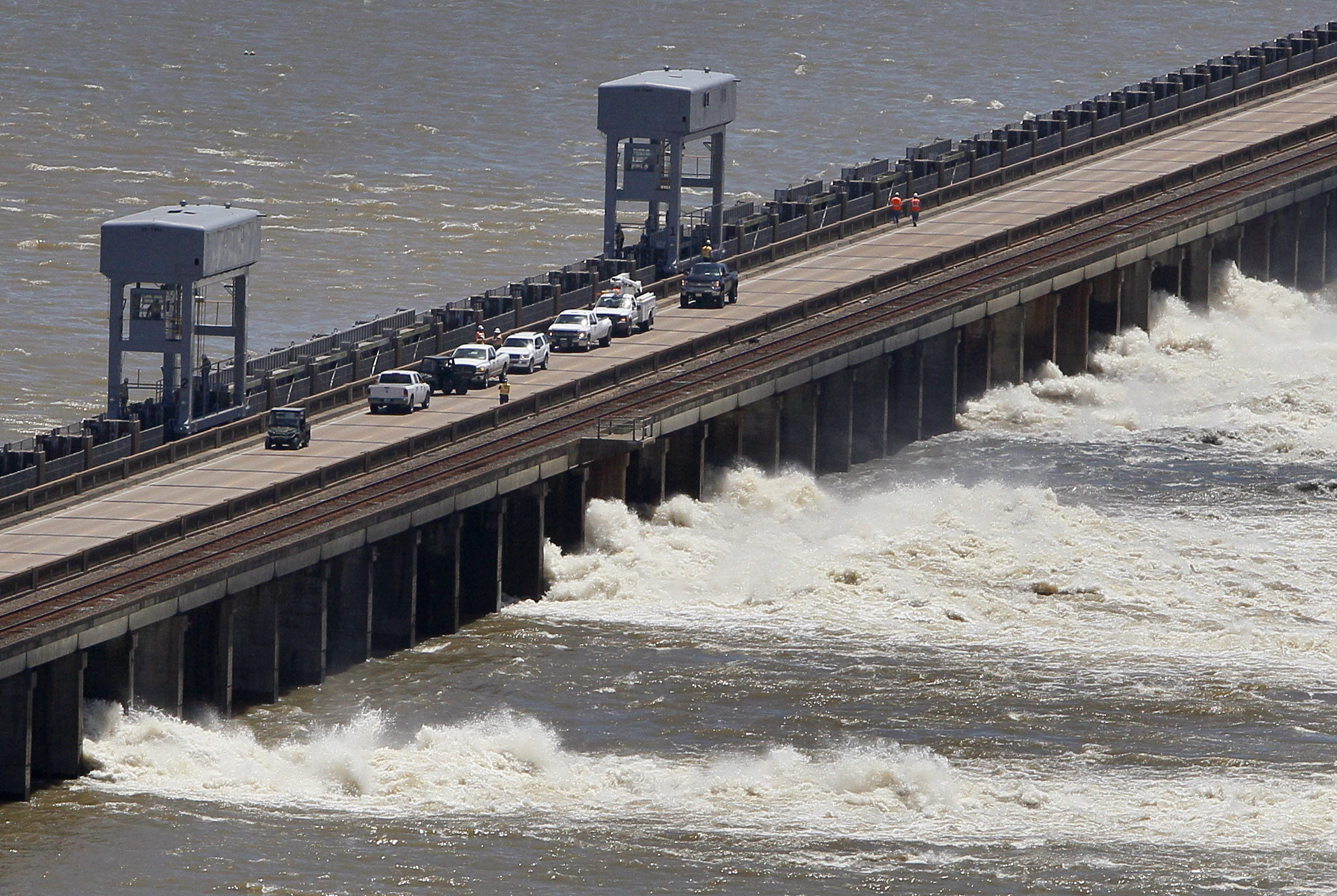 Water from the Mississippi River rushes out of open bays on the Morganza Spillway in Morganza, Louisiana. Water from the Mississippi River rushes out of open bays on the Morganza Spillway in Morganza, Louisiana.