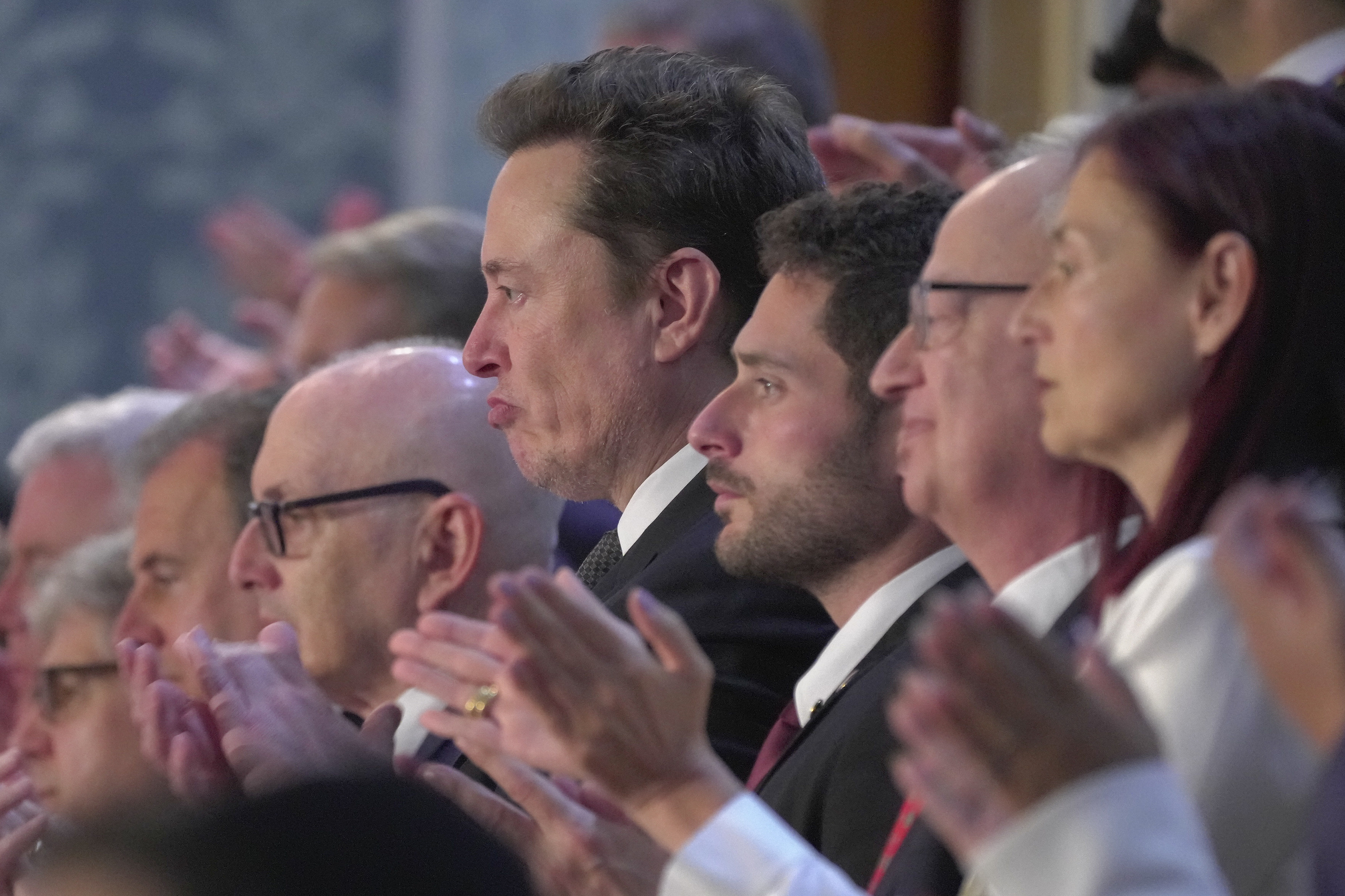 Elon Musk, center, applauds Israeli Prime Minister Benjamin Netanyahu during a joint meeting of Congress last month. Elon Musk, center, applauds Israeli Prime Minister Benjamin Netanyahu during a joint meeting of Congress last month.